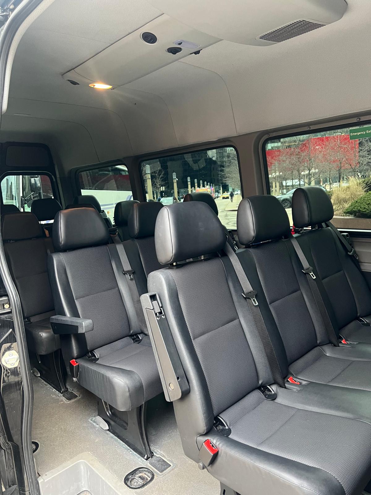 13-passenger Sprinter van interior with charcoal fabric and leather seating